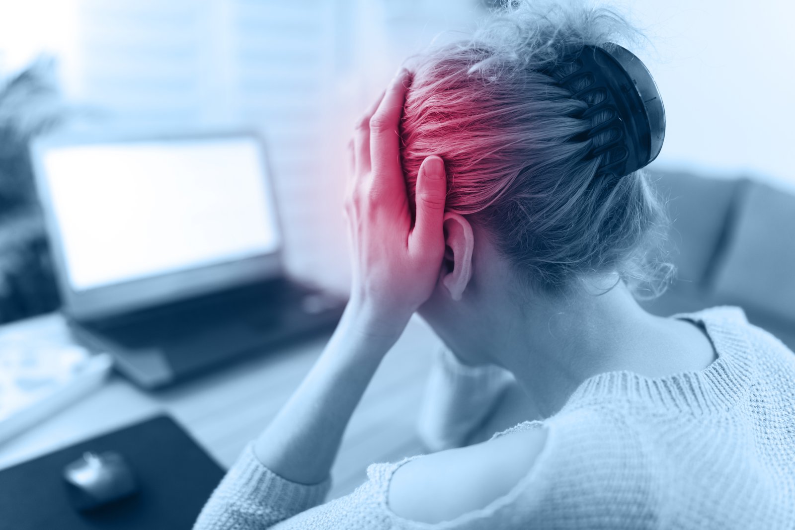 Woman finding relief from a tension headache