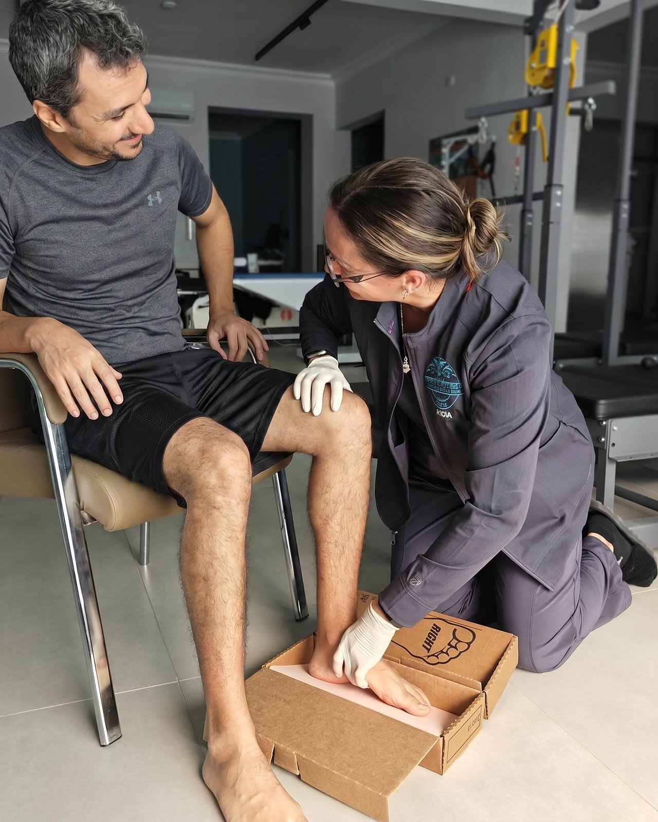 Taking a foam impression of a patient foot for custom orthotics at CBP Precision Spine Center