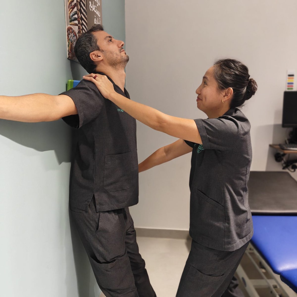 Mirror Image postural correction exercise guided by a physiotherapist, Muscat