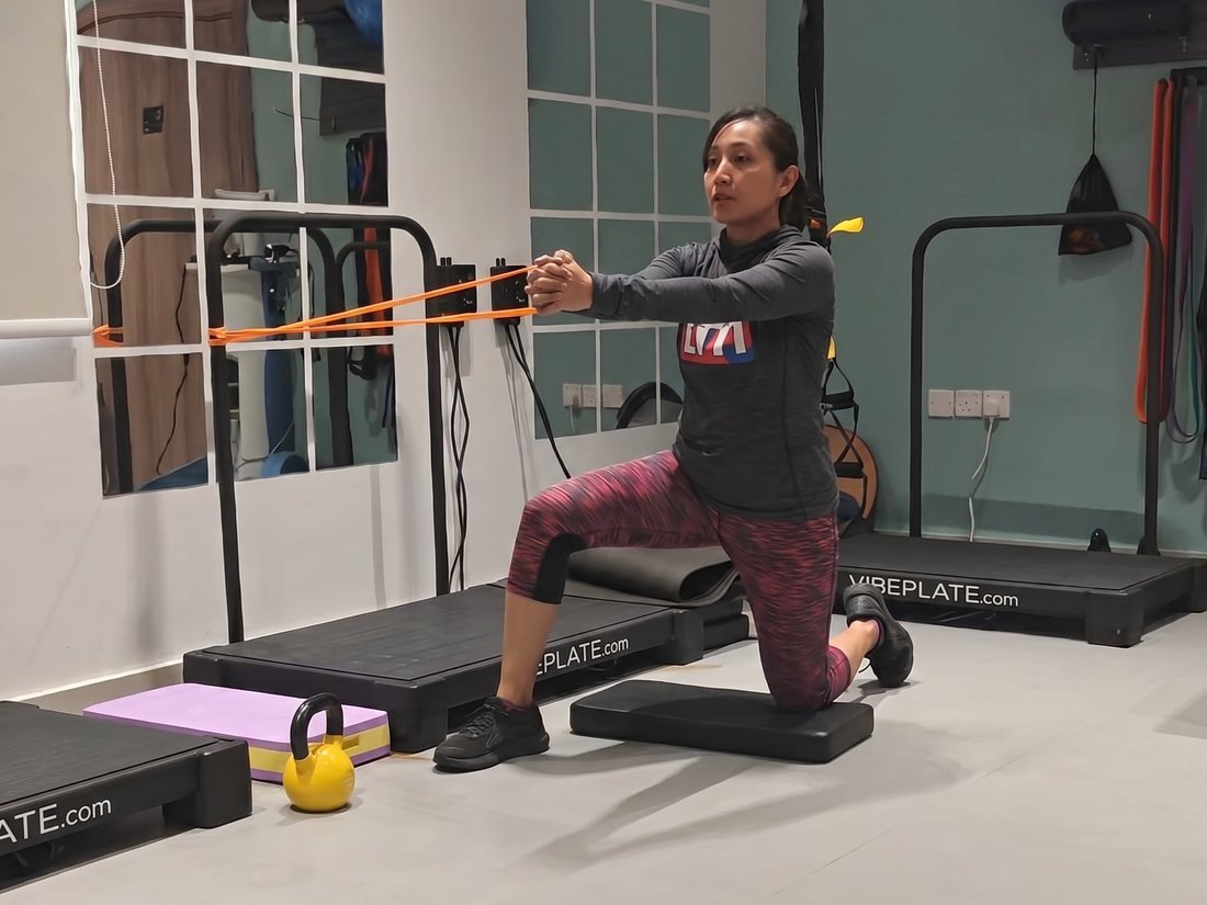 Patient doing guided resistance-band rehabilitation exercise